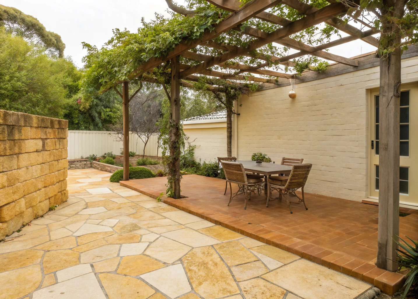 Mediterranean garden design Newcastle stone terrace with olive tree and terracotta pots